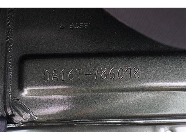 12865571